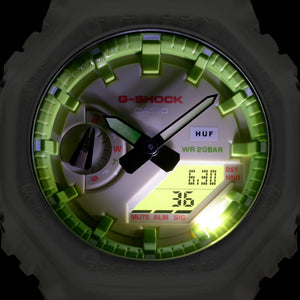 Casio G-Shock GA-2100HUF-5AER dial lit up with green backlight in darkness