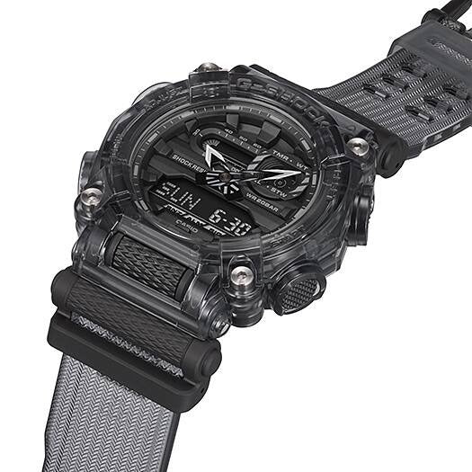 Casio G-Shock GA-900SKE-8AJR angled close-up showing translucent case and woven-texture strap