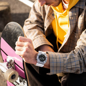 Casio G-Shock GA-900SKL-7AER on wrist close-up, outdoor lifestyle scene