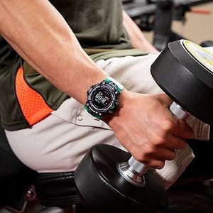 Casio G-Shock GBD-100SM-1A7ER worn on wrist during a dumbbell workout, gym lifestyle shot