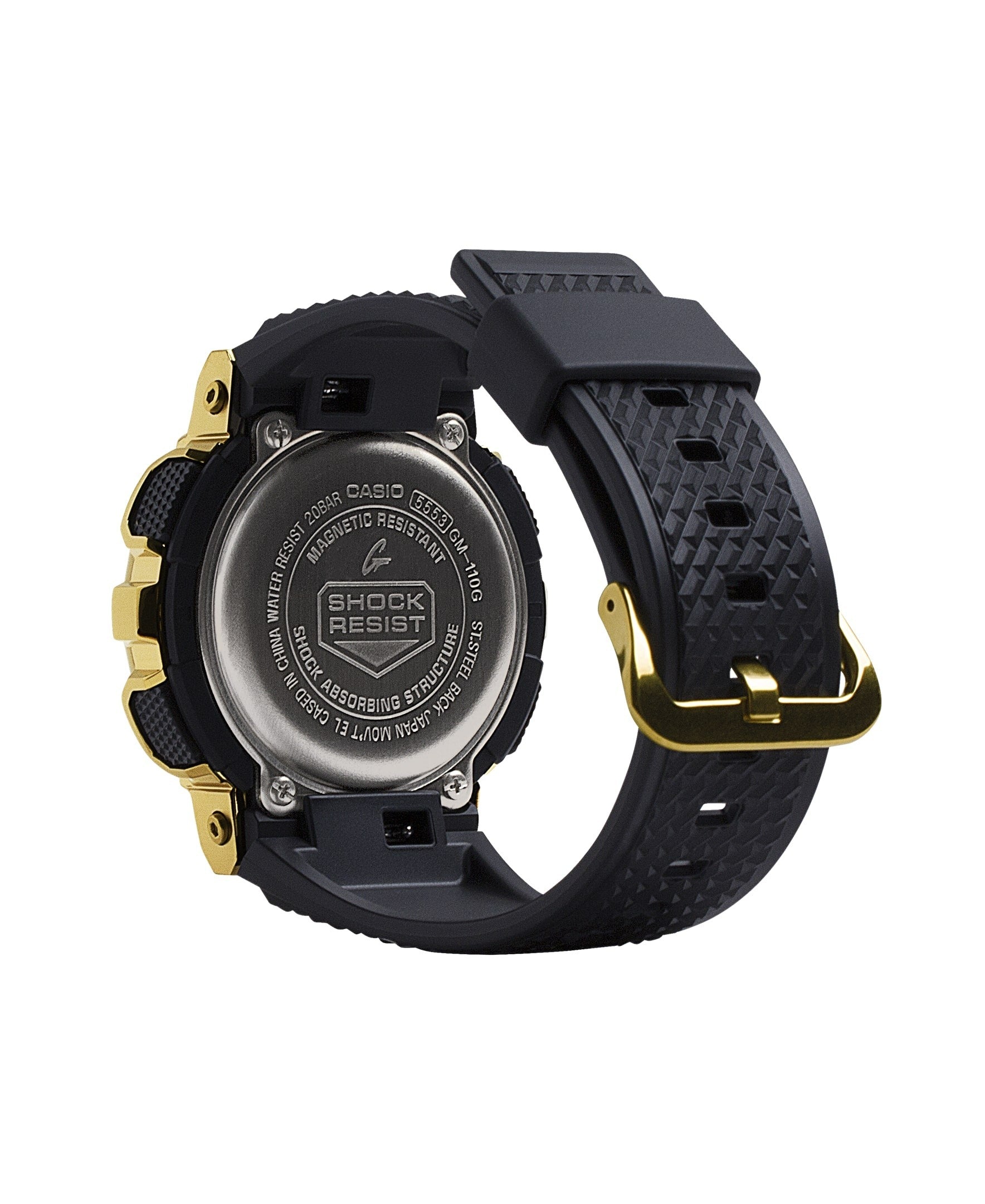 Casio G-Shock GM-110G-1A9ER case back detail showing gold-tone hardware and steel back
