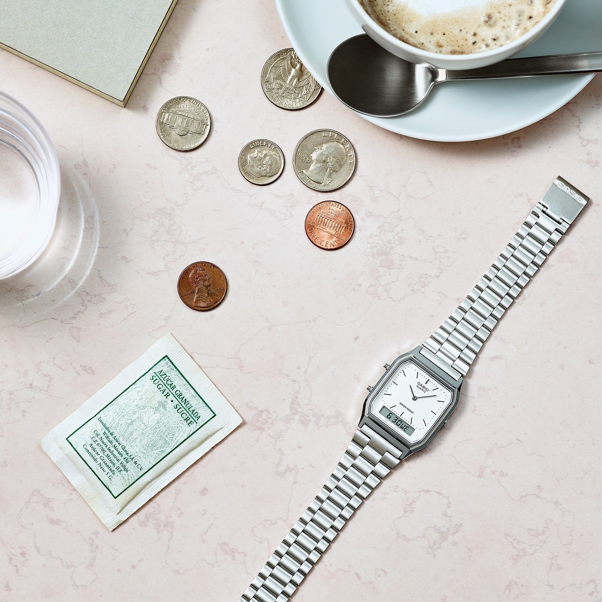 Casio AQ-230A-7DMQYES watch flat lay styled with coins and coffee cup, lifestyle shot
