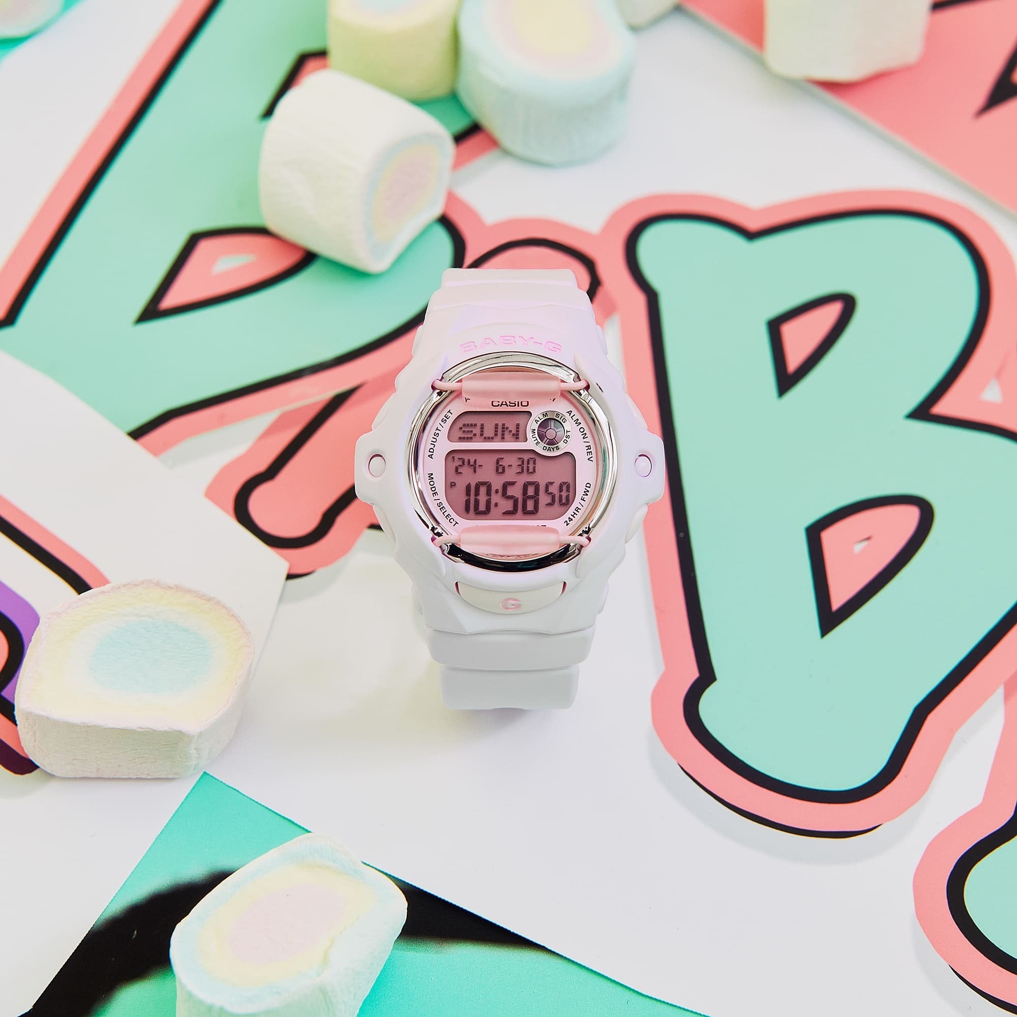Casio Baby-G BG-169M-4DR flat lay styled shot with pastel marshmallow props