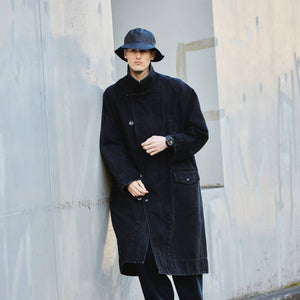 Casio G-Shock GA-110RG-1AER watch worn on wrist, street style lifestyle shot with model in bucket hat