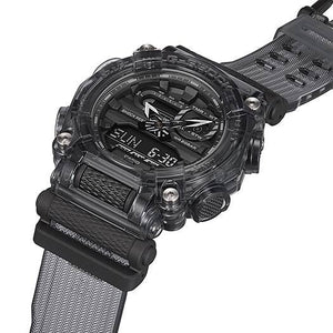 Casio G-Shock GA-900SKE-8AJR angled close-up showing translucent case and woven-texture strap